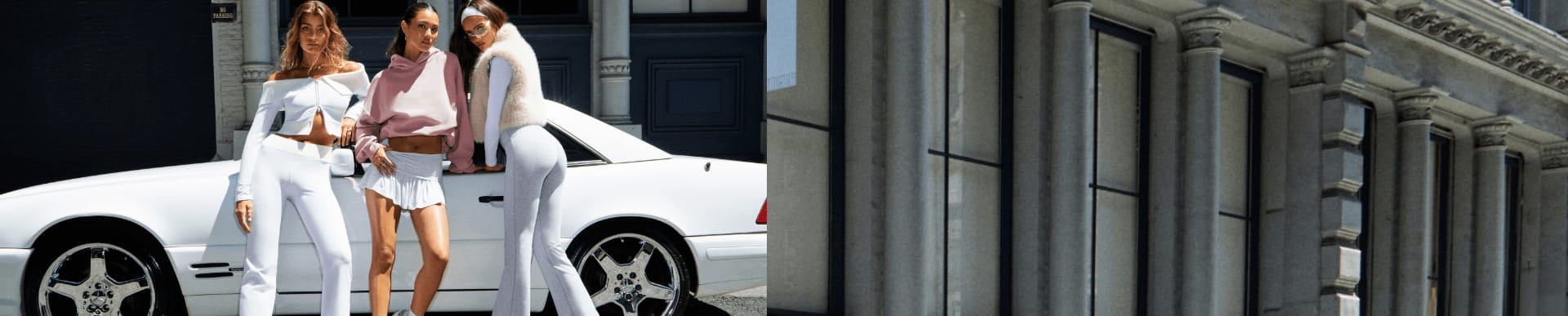 Models pose in front of a car. One is wearing a light grey cardigan and white pants. The next is wearing a pink hoodie and white pleated mini skirt. The other is in a faux fur vest, white long sleeve shirt, and grey sweats.