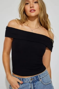 Model wears a black off the shoulder top.